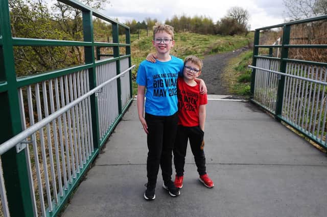Shieldhill brothers Jack and Stuart Hunter are walking a mile a day in May to raise money for the doctors and nurses who looked after their grandfather following a stroke. Picture: Michael Gillen.
