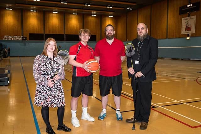 Climate change lead officer Claire Gibson (L) and Cllr Bryan Deakin (R) with staff at Grangemouth Sports Complex. Pic: Falkirk Council