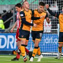 Ethan Ross, far right, helping Ross MacIver, centre, celebrate scoring during Falkirk's 3-0 win at home to Formartine United in the Scottish Cup's third round on Saturday (Photo: Michael Gillen)