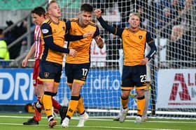 Ethan Ross, far right, helping Ross MacIver, centre, celebrate scoring during Falkirk's 3-0 win at home to Formartine United in the Scottish Cup's third round on Saturday (Photo: Michael Gillen)