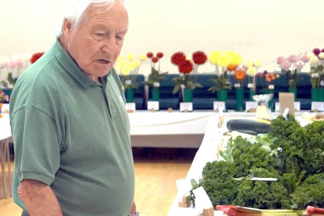 Polmont Horticultural Society Chairman Tom Sneddon has a final approving look at some of the exhibits in the vegetable classes.