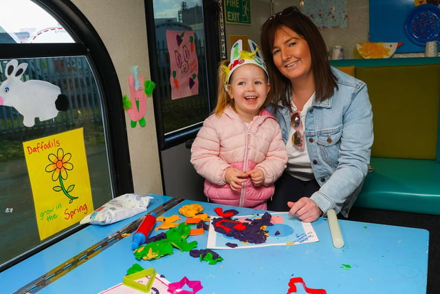 Sharlene and Emme, 4, enjoy some fun on the play bus during Inchyra Park Easter Egg Hunt