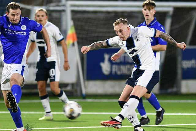 Calvin Miller unleashes a shot at the Queen of the South goal (Pic Michael Gillen)