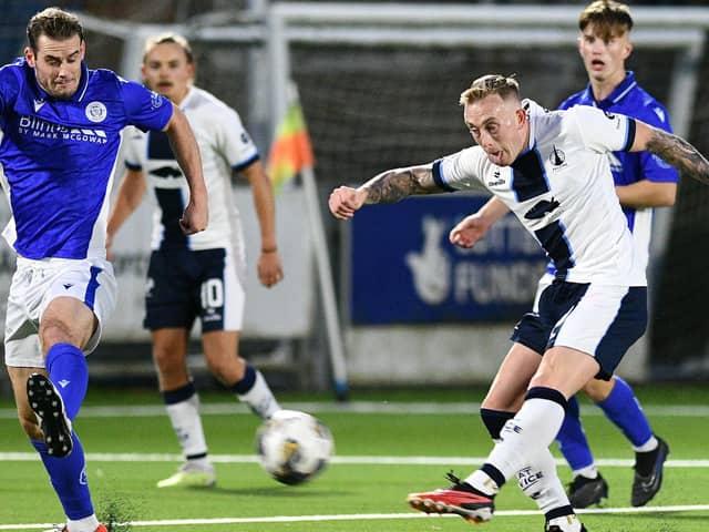 Calvin Miller unleashes a shot at the Queen of the South goal (Pic Michael Gillen)