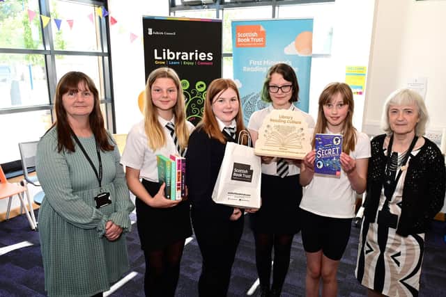 Pupils from Denny High School pictured with Debbie Scott from Denny Library, left, and Wendy Barr from Denny High School Library, right