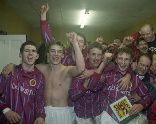 The Stenhousemuir players celebrate in the dressing room after defeating Aberdeen