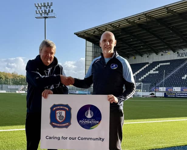 Falkirk Football Heritage Trust lead Michael White with Falkirk Foundation CEO Derek Allison in front of the Kevin McAllister Stand (Photo: Submitted)