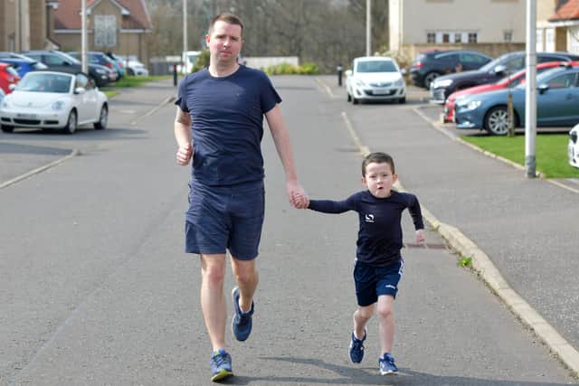 Graeme McCormack and son Harry McCormack on the last day of their five 5Ks for Strathcarron Hospice. Picture: Michael Gillen.