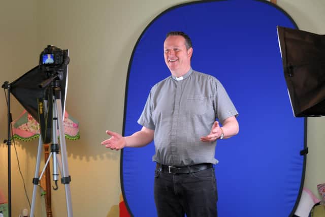 Falkirk Trinity Church's Reverend Robert Allan is used to being in front of the camera