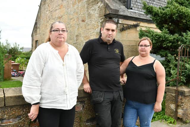John Erskine and partner Arlene Boles, of flood-hit Fairview Cottage in Maddiston with Shirley Erskine, who had previously lived in the property. Picture: Michael Gillen.