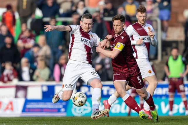 Stenhousemuir veteran Blair Alston looks to hold off Arbroath’s Thomas O’Brien during Saturday evening’s 4-0 defeat at Gayfield in Scottish League One (Pics by Ross Parker/SNS Group)