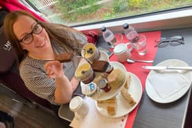 Pam Aldred prepares to enjoy LNER's luxury afternoon tea as the country whizzes by at 125mph