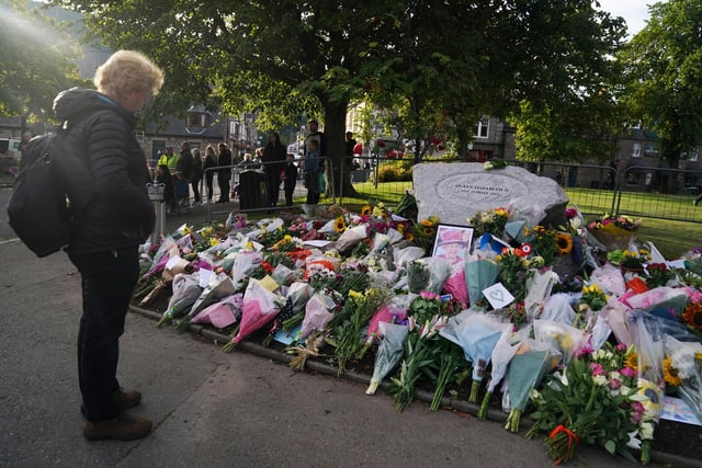 Pausing to pay tribute in Ballater this morning (Pic: PA/Andrew Milligan)