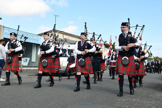East Kilbride Pipe Band led the procession through the town centre.