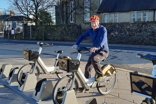 Councillor Paul Garner, Falkirk council spokesperson for the environment at the new electric bike hire station in Denny,