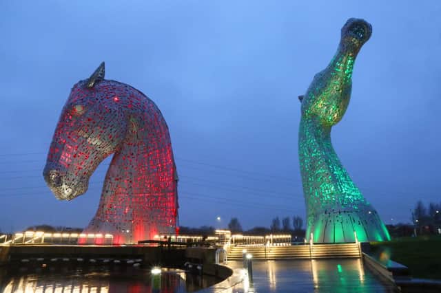 The Kelpies lit up in green and red to mark Christmas 2021.