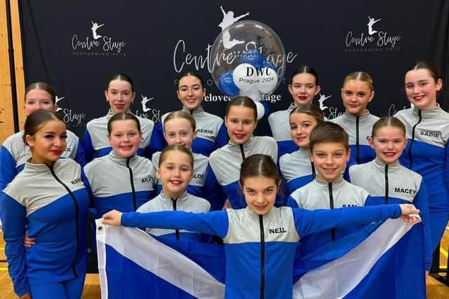 Nell (front) and her brother Sam (front row, right) and the Centre Stage Performing Arts competition team will be flying the flag for Team Scotland at the Dance World Cup.