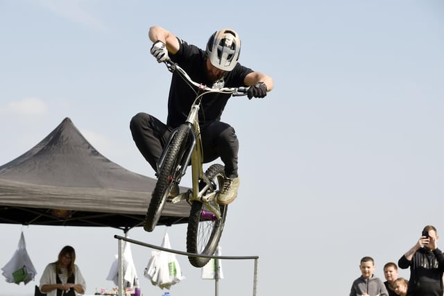 Showing off skills is this member of 3SIXTY Bicycle stunt team.
