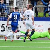Robbie Mutch saves the first-half penalty from Graham Webster (picture by Michael Gillen)