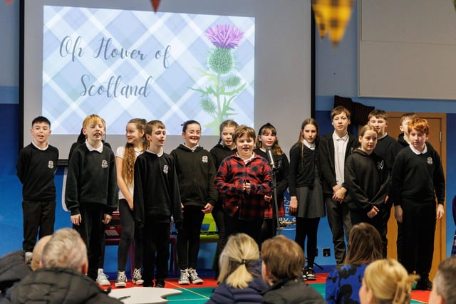 Pupils sing O Flower of Scotland.