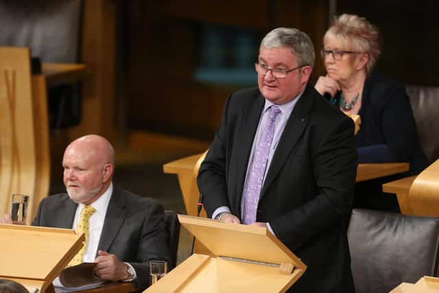 Angus MacDonald MSP in the debating chamber at Holyrood