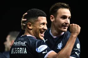 Juan Alegria is congratulated by teammate Liam Henderson