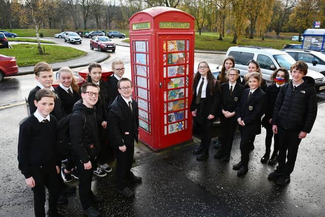 S1 and S2 pupils at Graeme High School have created a pop art display in the Antonine K6 phone box originally made by Carron Ironworks. Picture: Michael Gillen.