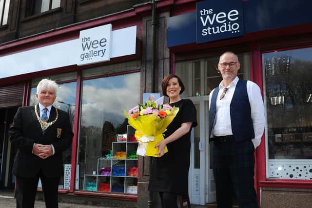 Provost William Buchanan; Lauren Campbell, owner of The Wee Gallery and The Wee Studio and Christo Craig, manager.