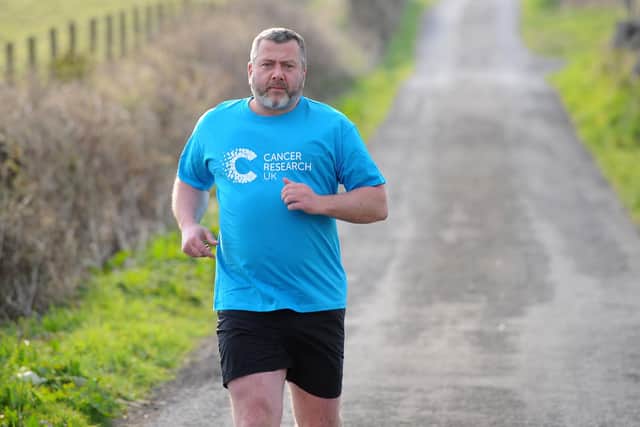 Dunipace resident Alan Purcell is tackling a 100km charity hill run in April in aid of Cancer Research in memory of his mum and two friends. Picture: Michael Gillen.