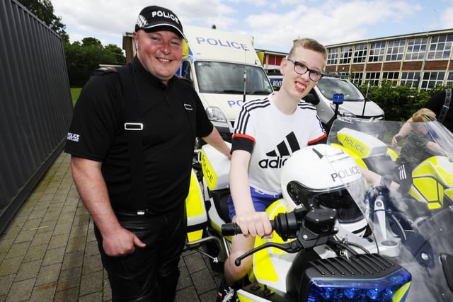Ian Anderson, 13), is in the driving seat with PC Mark Simpson of the National Motorcycle Unit based at Fettes in Edinburgh
