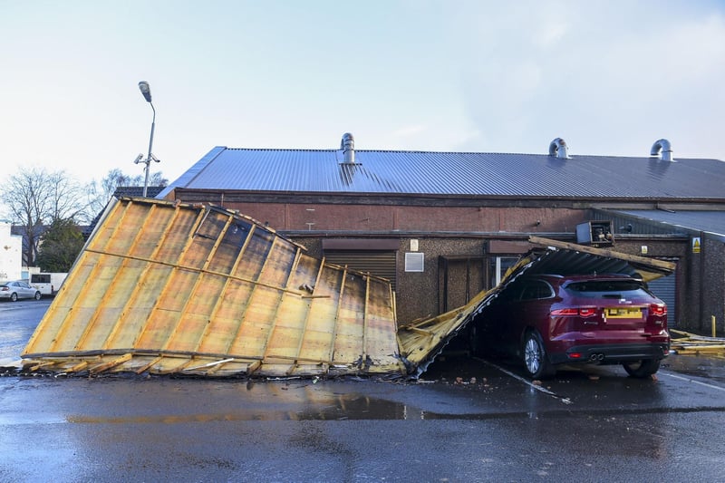 The roof landed on the parked car.