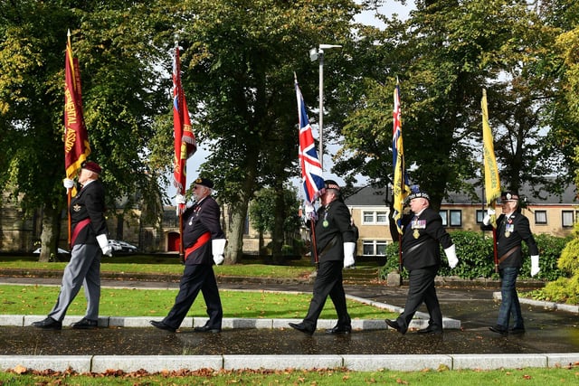The standard bearers take their places beside the memorial in Grangemouth's Zetland Park.