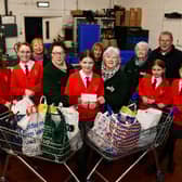 St Francis Xavier's RC Primary School, Faith and Action group handing over a cheque for £150 they raised doing various activities. Pic: Michael Gillen