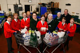 St Francis Xavier's RC Primary School, Faith and Action group handing over a cheque for £150 they raised doing various activities. Pic: Michael Gillen