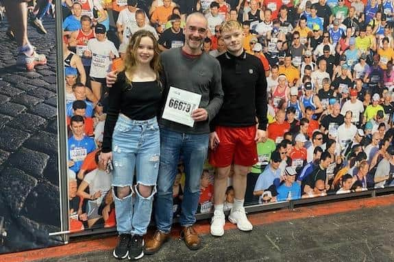 Maggie (12) and Sam (16) with their dad after the race.