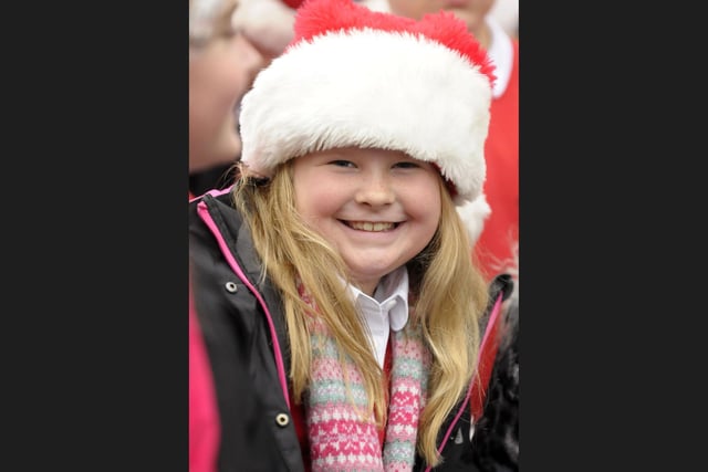 A smiling school pupil in the choir.