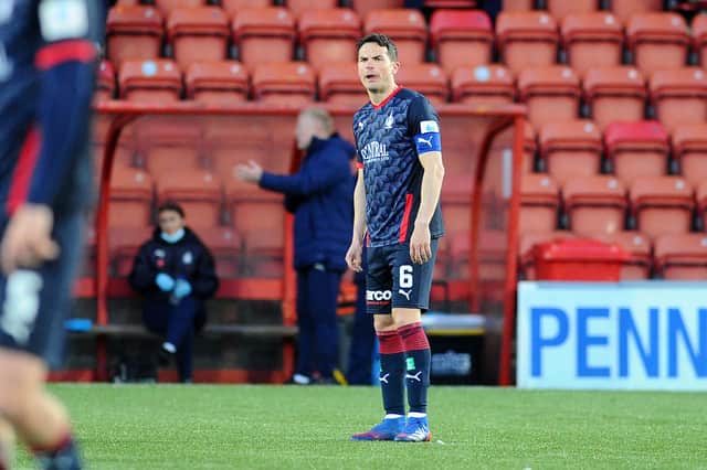 Falkirk captain Gary Miller looks devastated at the end of the game