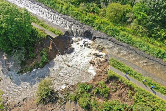 This aerial view shows the 30 metre wide breach in the Union Canal near Whitecross and Muiravonside after storms hit the area in August