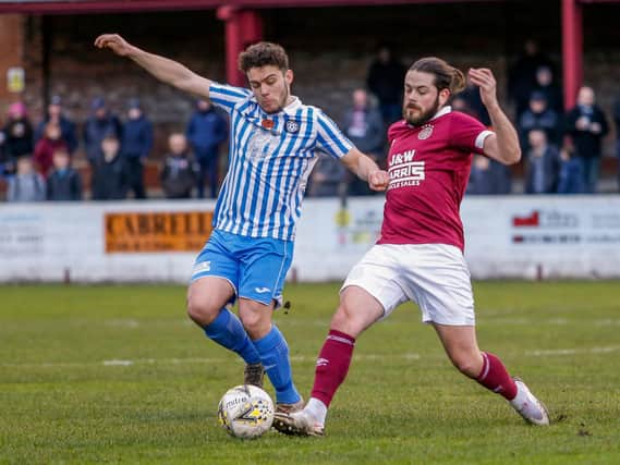 Linlithgow's Willis Hare (right) gets stuck in during Saturday's cup win (Pic by Andy Penman)
