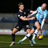Sean Mackie in acton against Dundee striker Zak Rudden