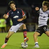 Layton Bisland on the ball for Falkirk against Ayr United's Logan Chalmers during an SPFL Trust Trophy tie (Photo: Michael Gillen)