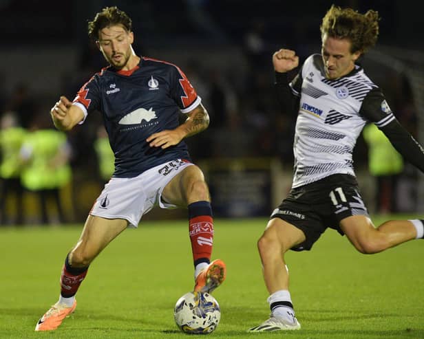 Layton Bisland on the ball for Falkirk against Ayr United's Logan Chalmers during an SPFL Trust Trophy tie (Photo: Michael Gillen)