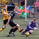 Stenhousemuir keeper David Wilson and defender Nicky Jamieson combine to keep out Annan's Iain Anderson (pic: Andrew Pool/Annan Athletic FC)