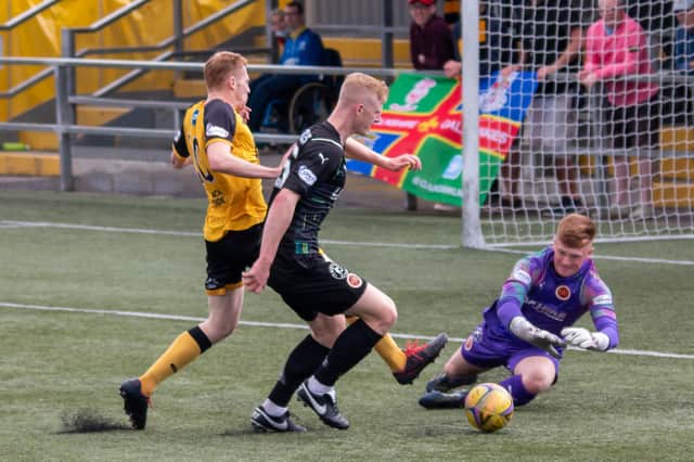 Stenhousemuir keeper David Wilson and defender Nicky Jamieson combine to keep out Annan's Iain Anderson (pic: Andrew Pool/Annan Athletic FC)