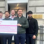 Jamie Lunn, 27, from Falkirk is running the Edinburgh Marathon later this month whilst raising money for Worldwide Cancer Research. Jamie, far left, with work colleagues. Pic: Contributed