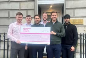 Jamie Lunn, 27, from Falkirk is running the Edinburgh Marathon later this month whilst raising money for Worldwide Cancer Research. Jamie, far left, with work colleagues. Pic: Contributed