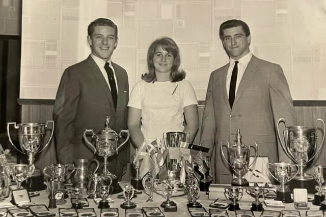 The Johnstons with their many trophies for water skiing, left to right, Bill, Sheila and David. Pic: Contributed