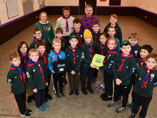The 16th Laurieston Scout Group has installed an AED (Automated External Defibrillator) outside the Scout Hall. Cubs are pictured with the life-saving equipment.  Pic: Michael Gillen