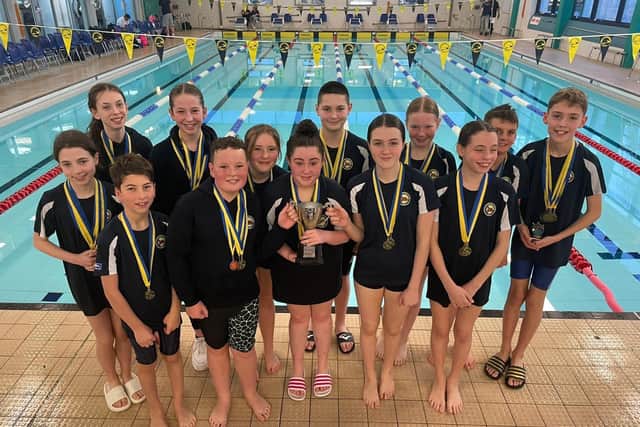 Members of Falkirk Otter Swimming Club with their J.A.G.S trophy (Pics: Contributed)