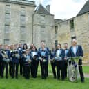 Kinneil Band recently provided the sound track for King Charles' visit to the town.  They will be playing movie music at a free concert at the town's bandstand next month. (Pic: Michael Gillen)